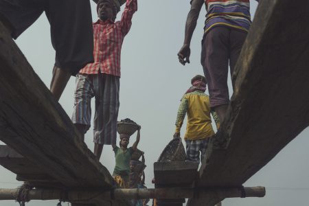 Coal workers walk back and forth on a plank of wood numerous times a day without losing balance Transport bridges at the coal facility in Dhaka, Bangladesh are made from wooden planks.