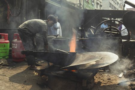 Without shoes, masks or gloves, this teenager works under scorching conditions. Putting his life at risk for only less than $ 2 a day. Without shoes, masks or gloves, this teenager works under scorching conditions manipulating metal parts at Dhaka, Bangladesh Shipyard.