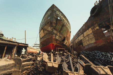 Worn, run-down, damaged, and in need of extensive repairs. Many huge vessels can be found at the Shipyard by the river Buriganga, Dhaka, Bangladesh. Huge vessel on site at Dhaka, Bangladesh Shipyard for repairs.