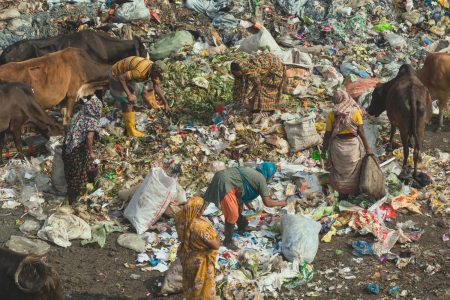 Parents sift tirelessly through endless hills of waste, earning enough money for one more day of food for their children. Finding items of value amongst rubbish in Chittagong, Bangladesh.
