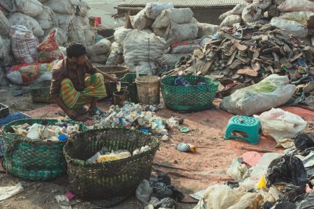 Waste sorting station. The Waste Pickers of Bangladesh sort rubbish into saleable product piles.