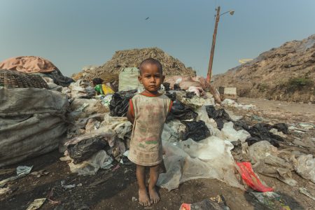 A child waits patiently for the mother. A child waits for the mother in Chittagong, Bangladesh.